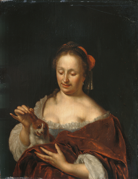 A Lady Seated Holding a Small Dog