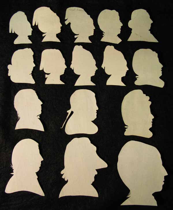 Sixteen White Paper Cut Out Portraits