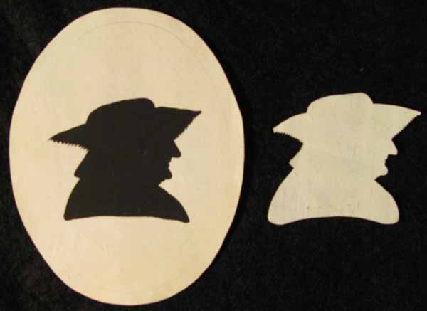 Two Black Cut Out Paper Silhouette Portraits of a Man