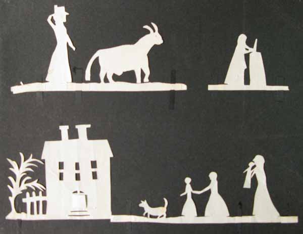 Three White Paper Cut Out Silhouettes of a Man and Bull, a Man stood next to a Large Object, and a Woman with Three Children